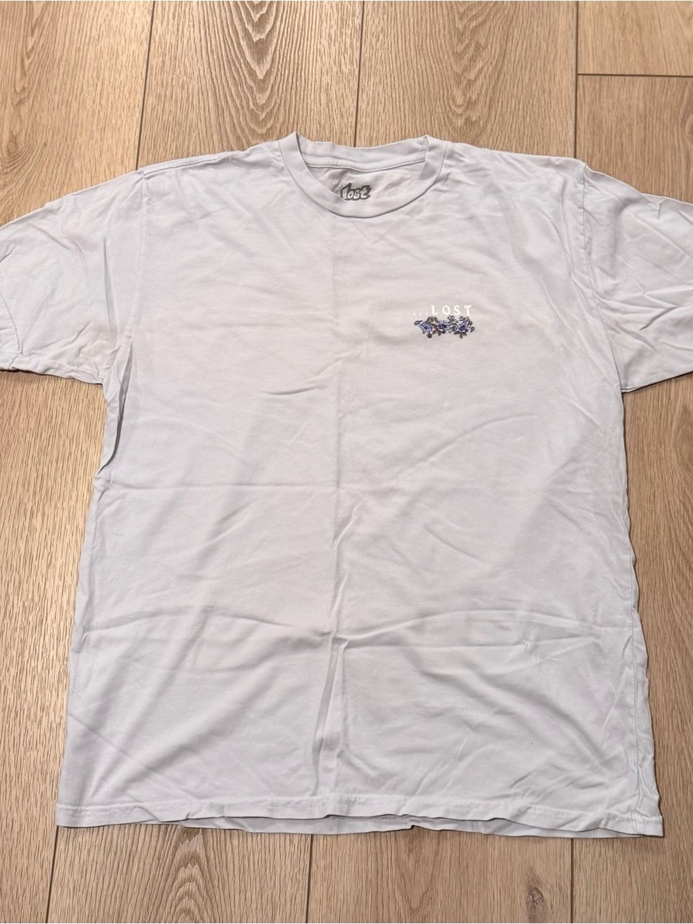 Lost Light Gray Crewneck Tee with Small Floral Chest Graphic